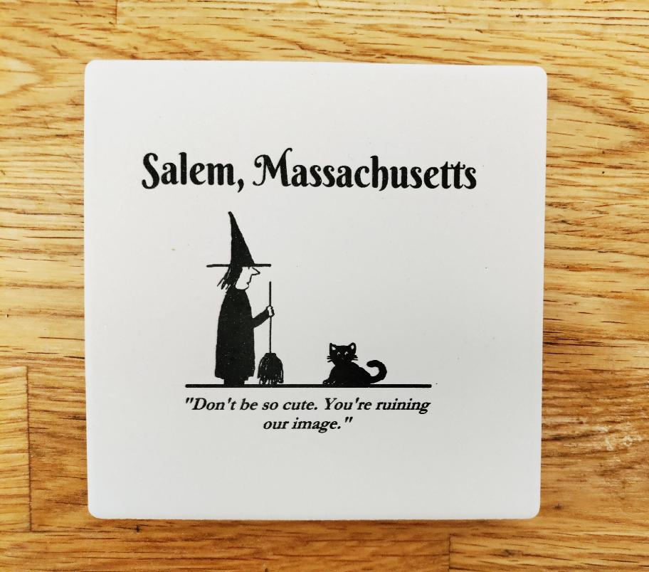 Salem, Massachusetts "Don't be so cute. You're ruining our image." White, ceramic coaster with cork bottom.