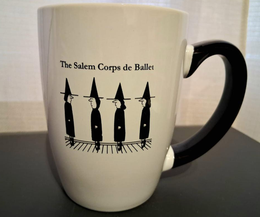 The Salem Corps de Ballet. White, ceramic, 12oz mug with black handle and interior.